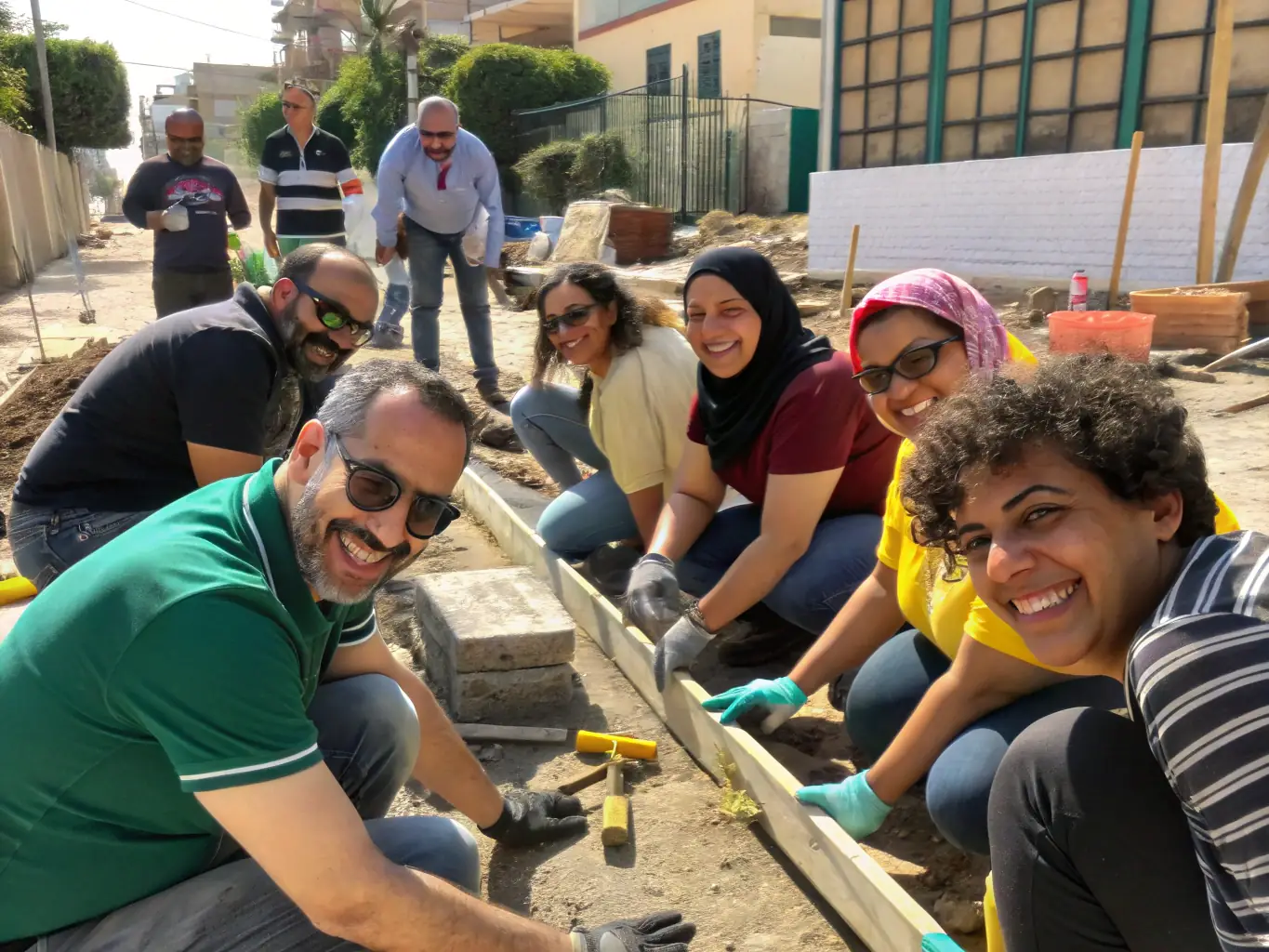 A diverse group of A.P.H. members of different ages and backgrounds working together on a community project, emphasizing inclusivity and collaboration.